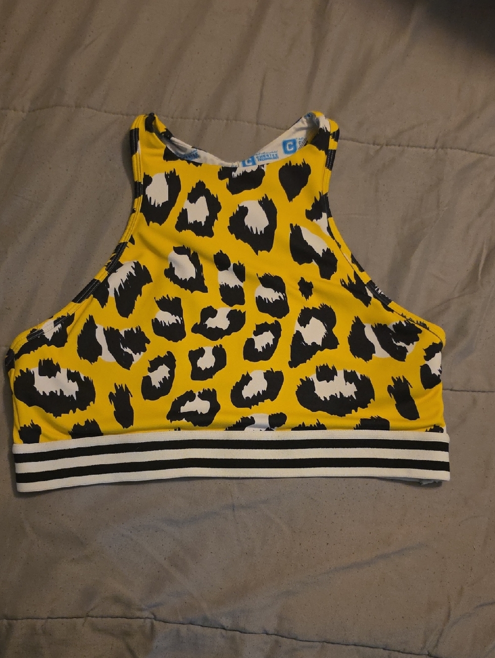 The Chestee Yellow Leopard High-Neck Sports Bra with Striped Band